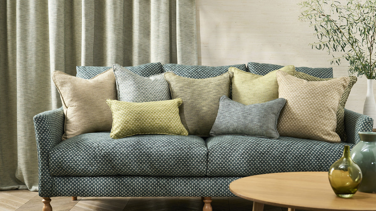 Ashley Wilde Harrison fabric on a sofa with cushions and matching curtains